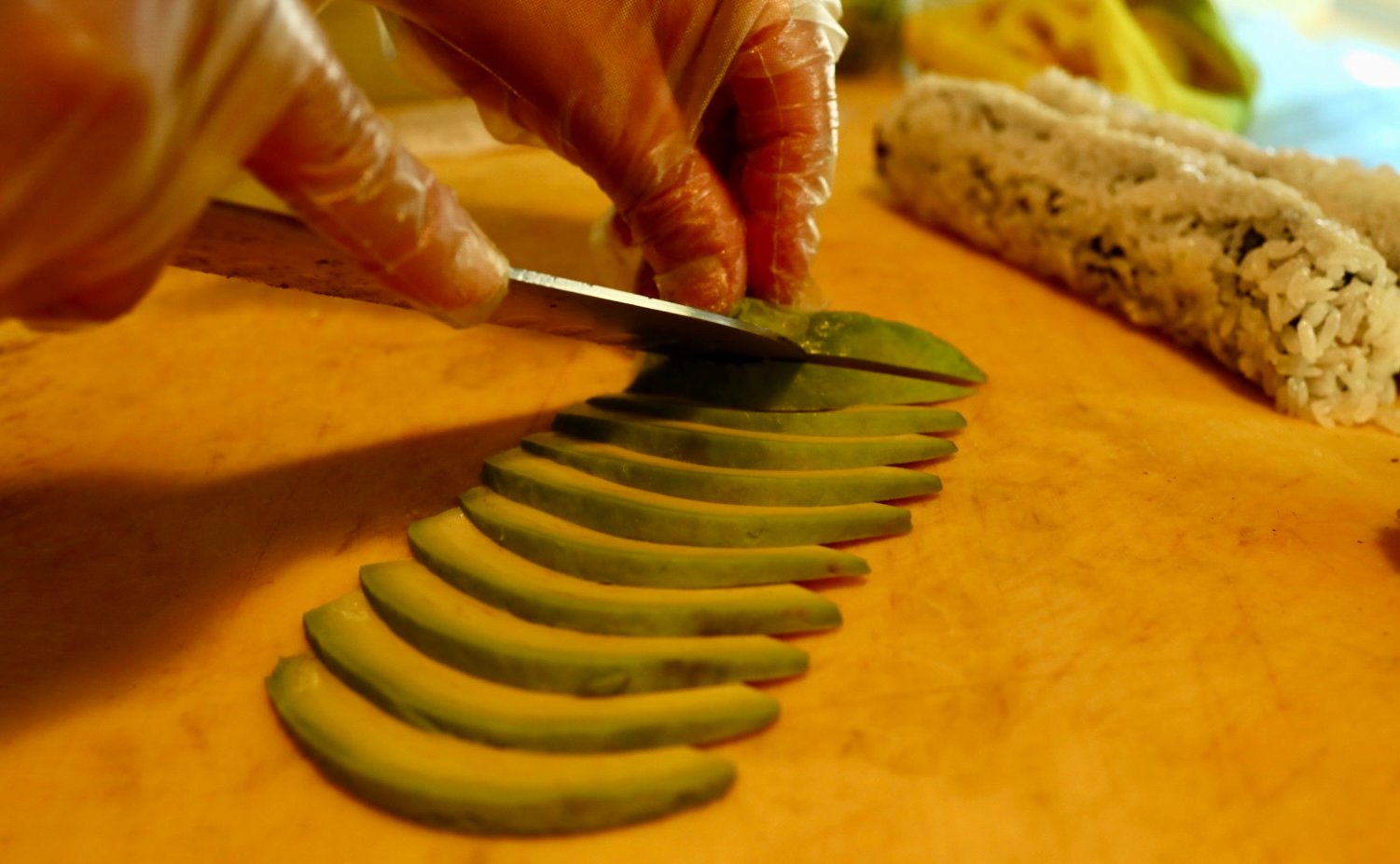 Avocado cut into perfect slices in a column.